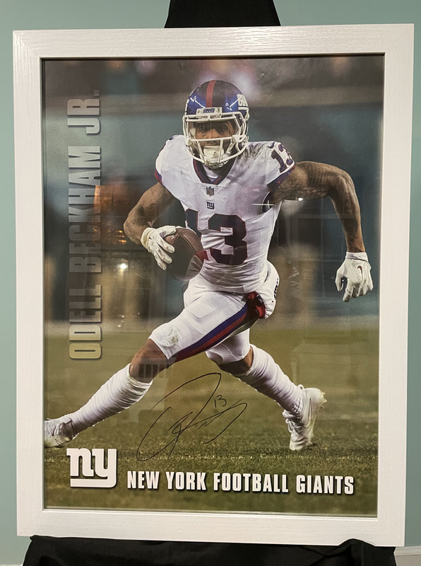 “New York Giants Odell Beckham Jr 
Autographed Poster Frame”

Giants Odell Beckham Jr pre-autographed
Lithographed Poster,18" x 24”
Donated by New York Giants Company
